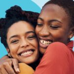Two friends hugging warmly, showing genuine connection and love