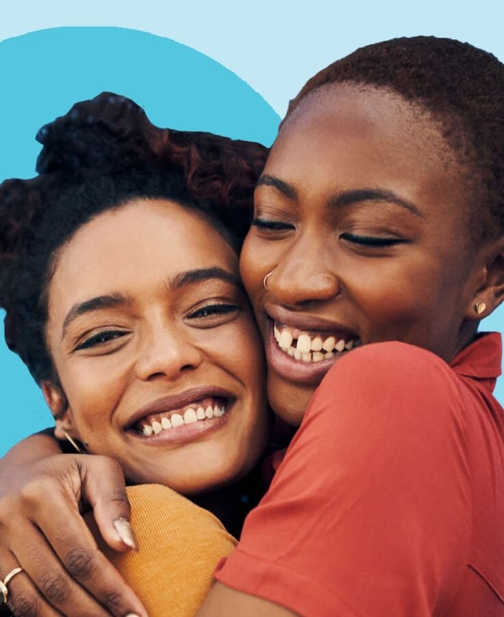 Two friends hugging warmly, showing genuine connection and love
